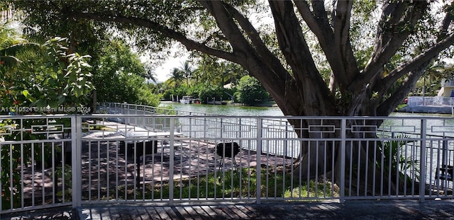 view of gate with a water view