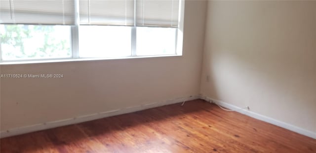 empty room featuring hardwood / wood-style flooring