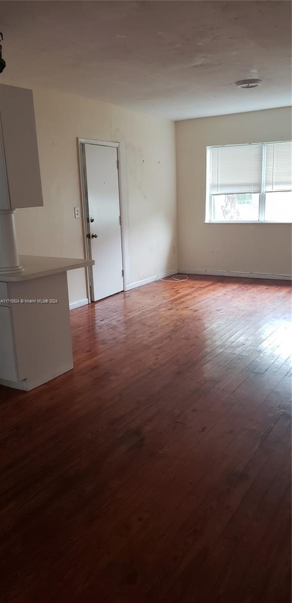 empty room featuring hardwood / wood-style floors