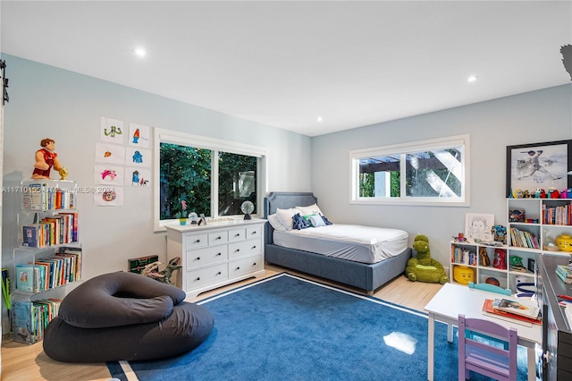 bedroom with light hardwood / wood-style flooring