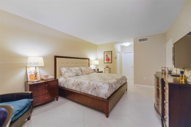 bedroom featuring visible vents and baseboards