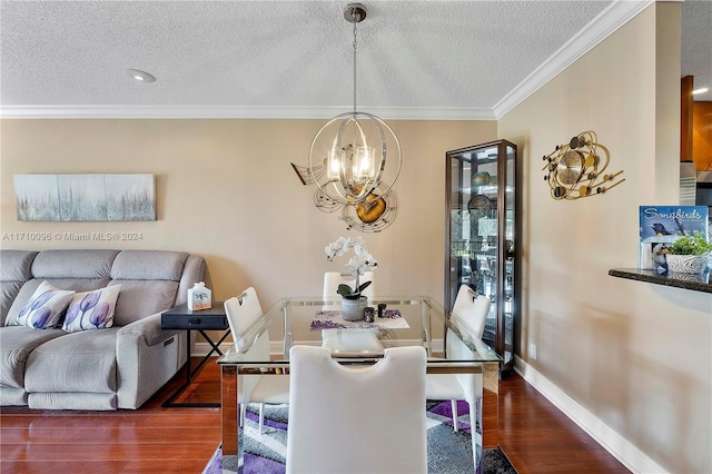 dining room featuring a textured ceiling, dark hardwood / wood-style flooring, and ornamental molding