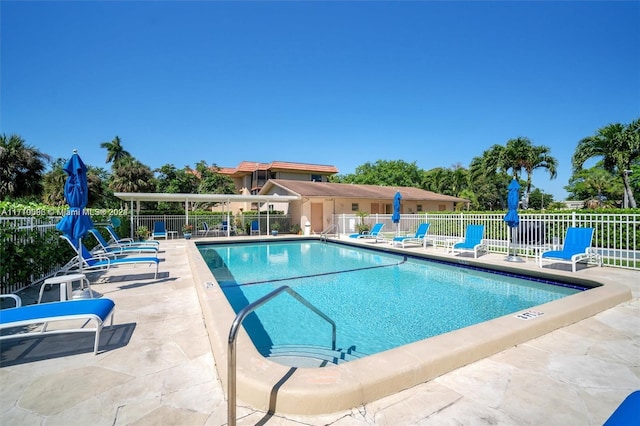 view of swimming pool with a patio