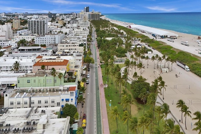 birds eye view of property featuring a view of the beach and a water view