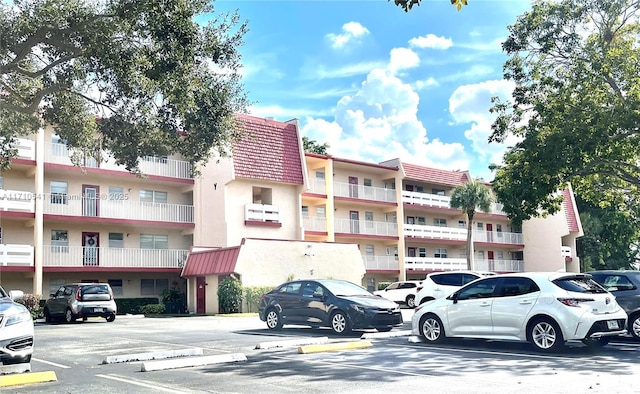 view of property with uncovered parking