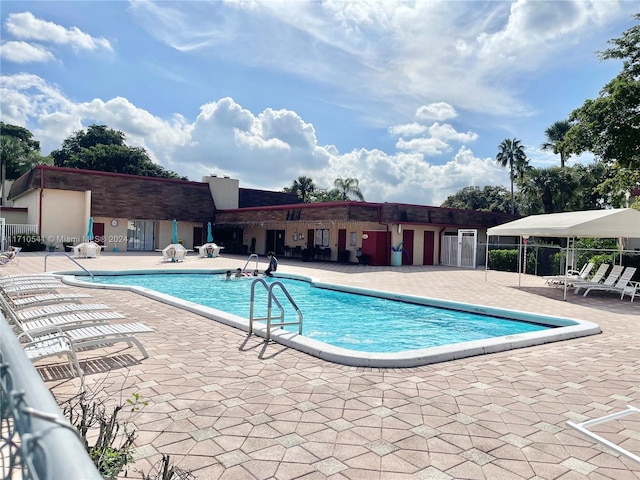 view of swimming pool with a patio area