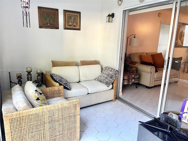 living area with tile patterned floors