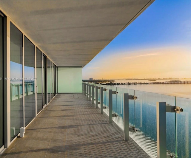 balcony at dusk with a water view