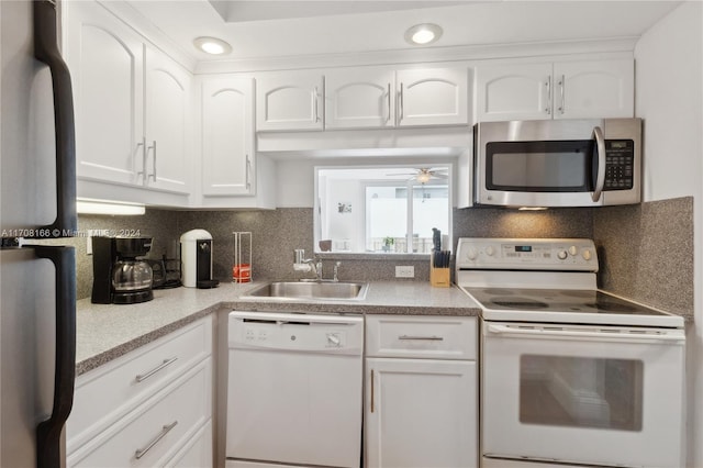 kitchen featuring backsplash, white cabinets, sink, ceiling fan, and stainless steel appliances