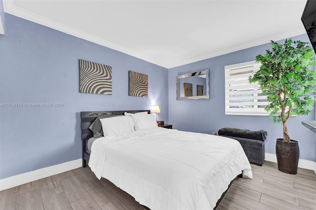 bedroom with light wood-type flooring