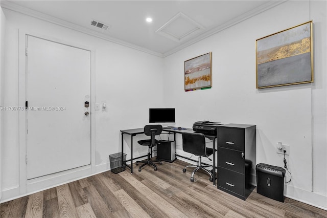 office space featuring hardwood / wood-style flooring and crown molding