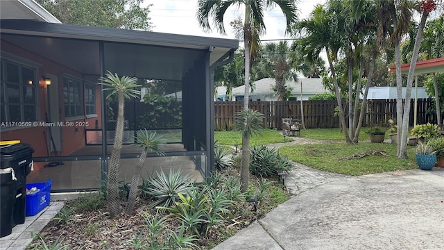 view of yard with a sunroom