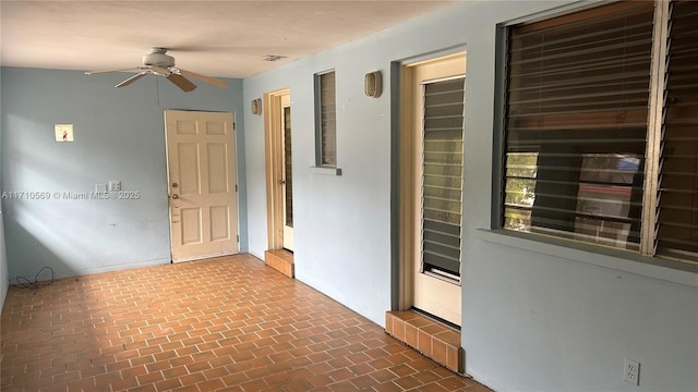 interior space featuring ceiling fan