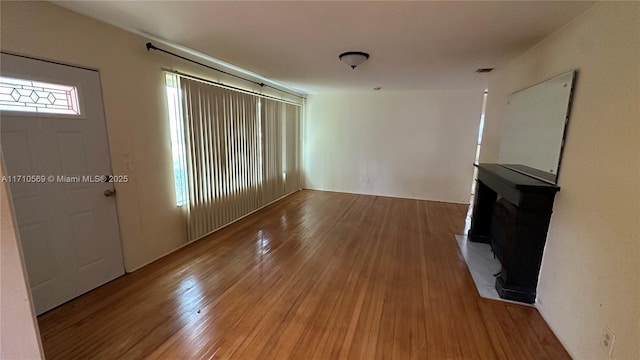 unfurnished living room with hardwood / wood-style floors