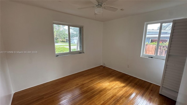 empty room featuring hardwood / wood-style floors, plenty of natural light, and ceiling fan