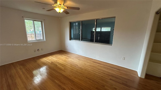 unfurnished room featuring hardwood / wood-style floors and ceiling fan