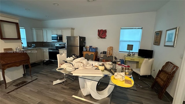 dining space featuring dark hardwood / wood-style floors