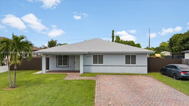 view of front of home with covered porch and a front yard