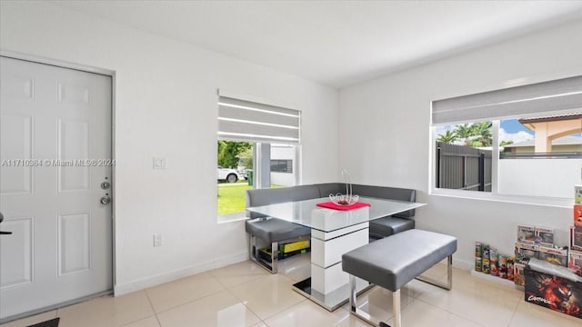 tiled dining room with plenty of natural light