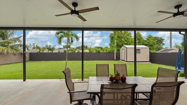 sunroom with a wealth of natural light and ceiling fan