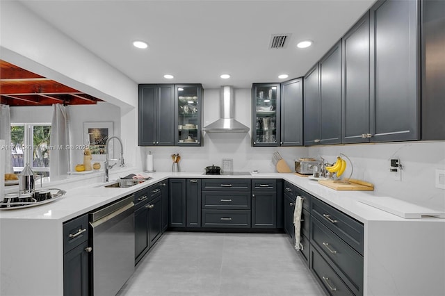 kitchen with stainless steel dishwasher, wall chimney exhaust hood, kitchen peninsula, and sink