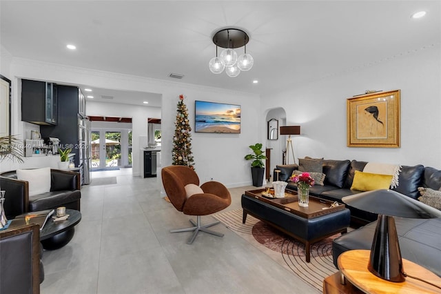 living room featuring french doors and ornamental molding