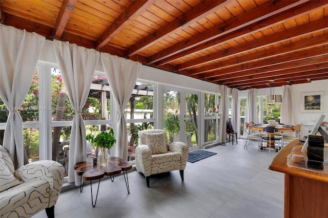 sunroom featuring beamed ceiling and wood ceiling