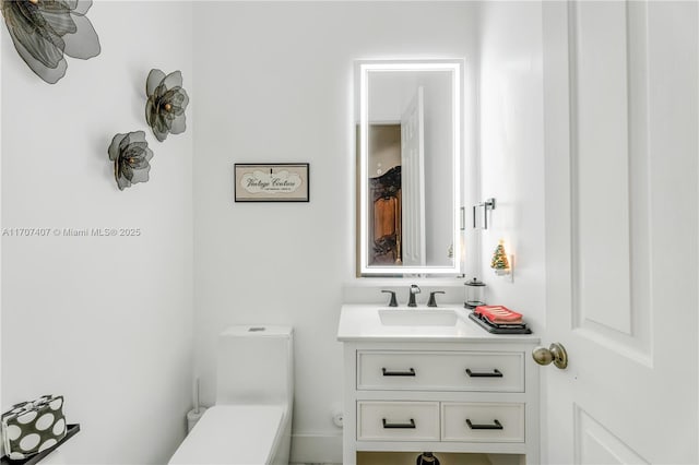 bathroom with vanity and toilet