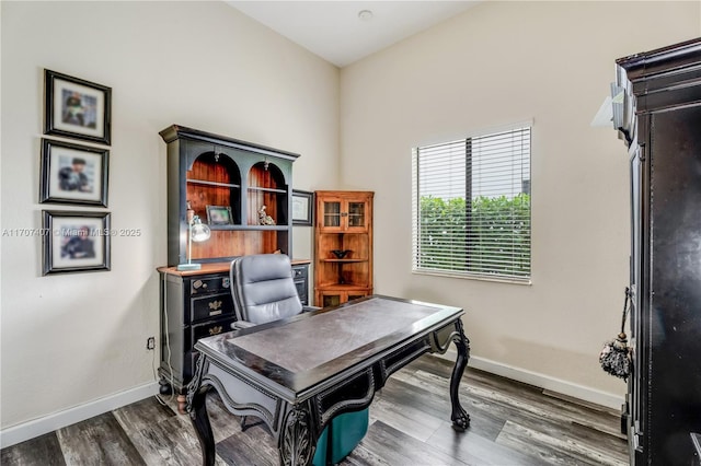 home office featuring dark wood-style floors and baseboards