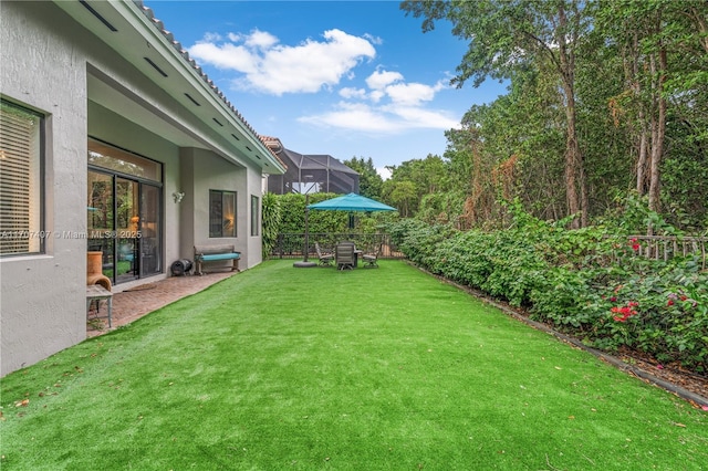 view of yard with a lanai