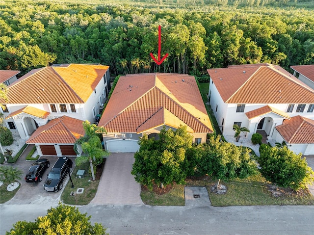 aerial view featuring a wooded view