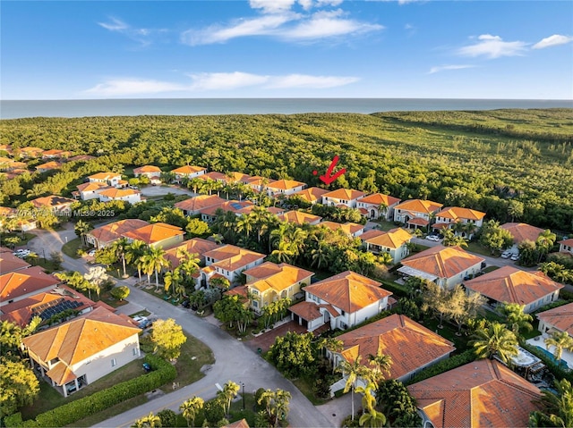 bird's eye view featuring a water view and a residential view