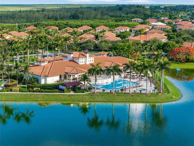 birds eye view of property featuring a water view