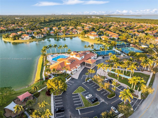 bird's eye view with a water view and a residential view