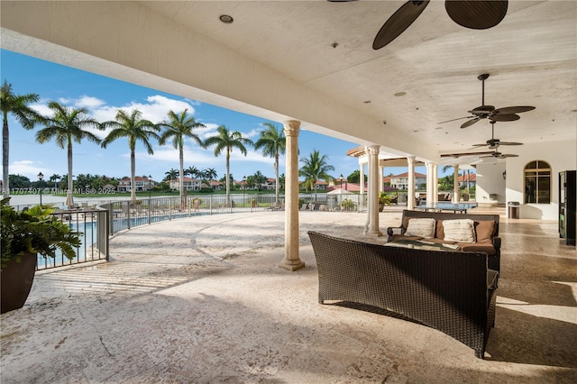 view of patio featuring ceiling fan and exterior kitchen