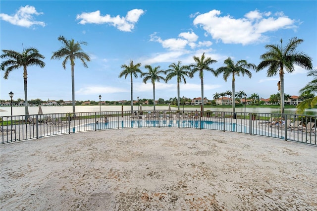 view of swimming pool featuring a water view