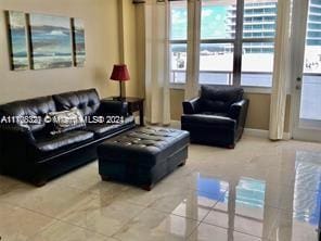 living room with tile patterned flooring