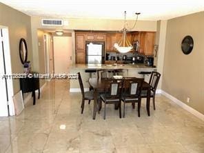 3725 S Ocean Dr Unit 1605, Hollywood, FL 33019 - dining area featuring baseboards