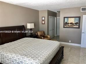 bedroom featuring a textured ceiling