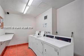 3725 S Ocean Dr Unit 1605, Hollywood, FL 33019 - shared laundry room featuring washer and dryer and tile patterned floors