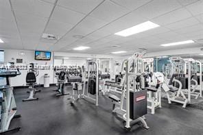 workout area featuring a paneled ceiling