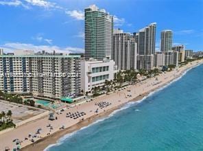 aerial view featuring a beach view and a water view