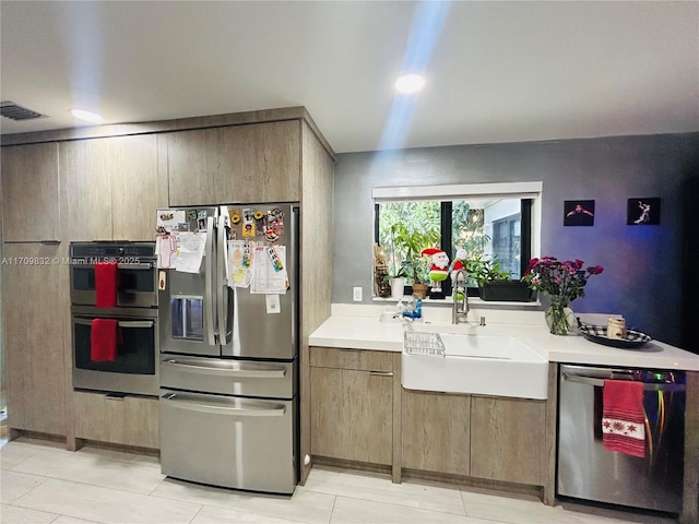 kitchen with sink and appliances with stainless steel finishes