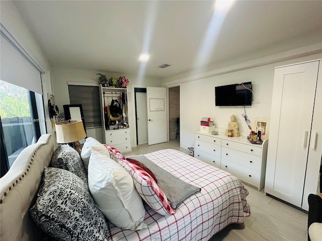 bedroom with light wood-type flooring