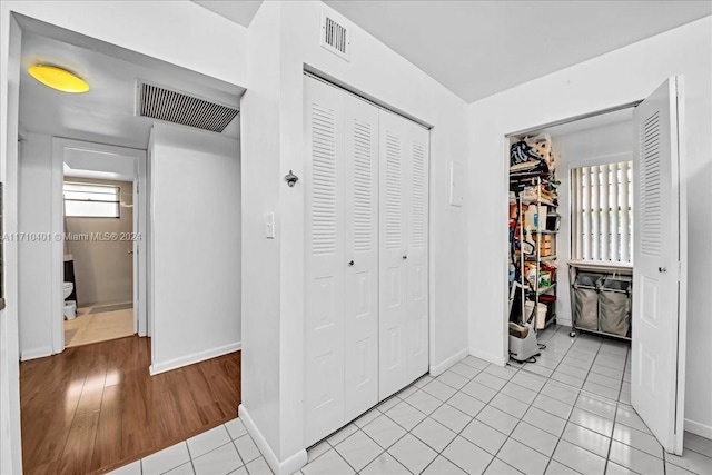 corridor featuring light hardwood / wood-style flooring