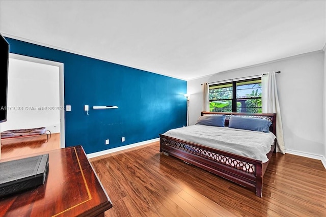 bedroom featuring hardwood / wood-style floors