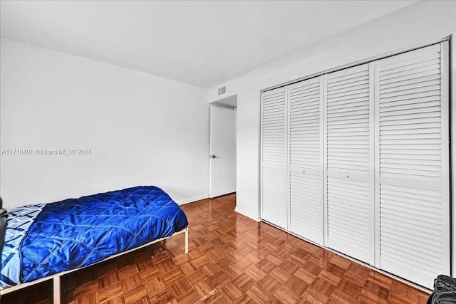 bedroom with parquet flooring