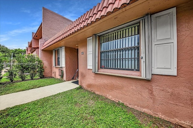 property entrance with a yard