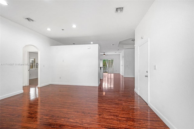 unfurnished room featuring ceiling fan and dark hardwood / wood-style flooring