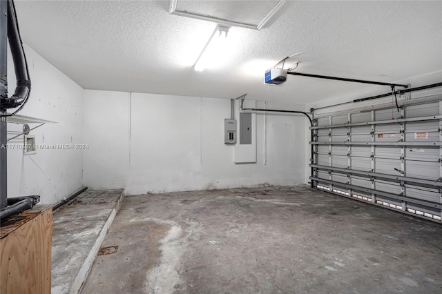 garage featuring electric panel and a garage door opener